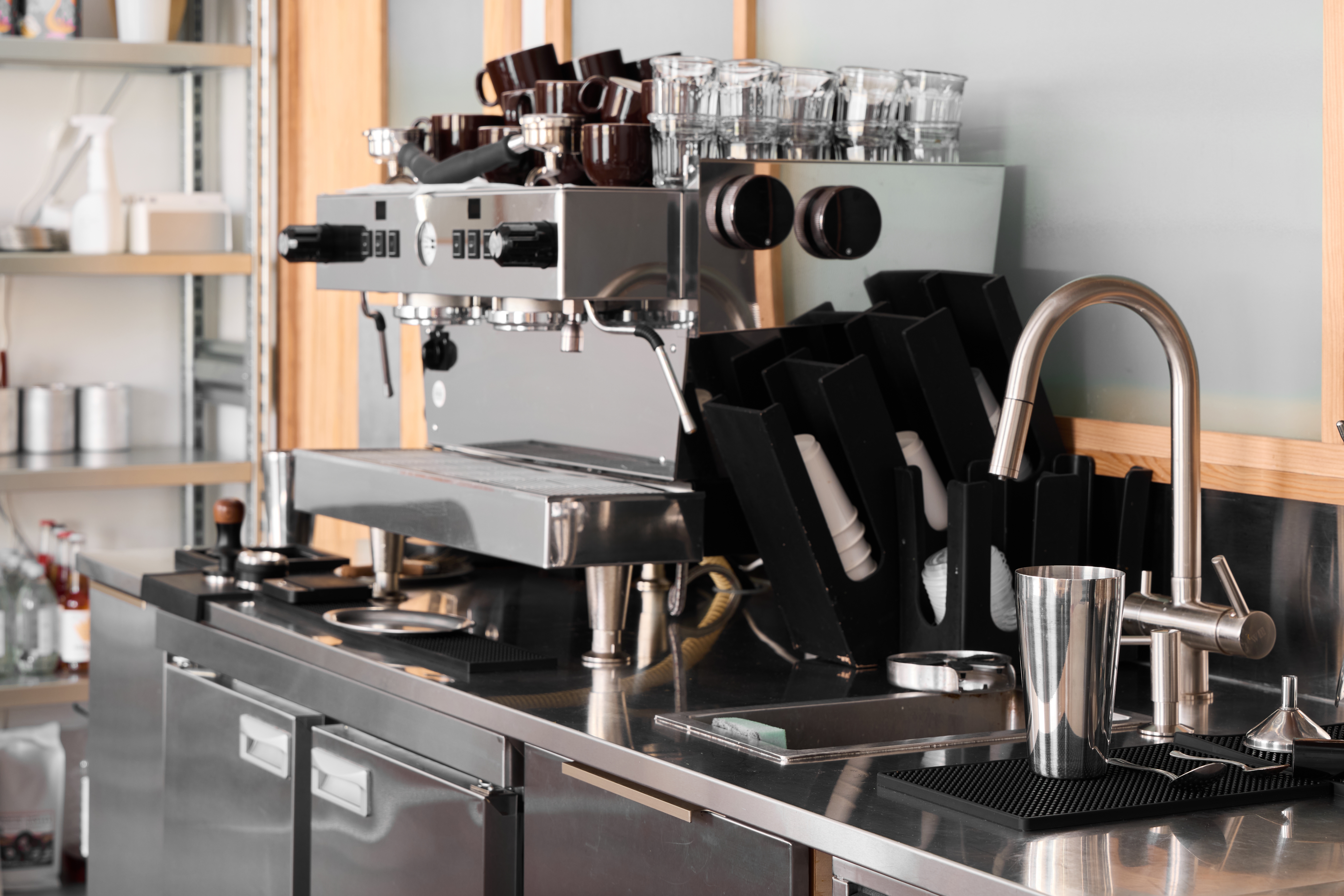 coffee shop with barista using coffee equipment