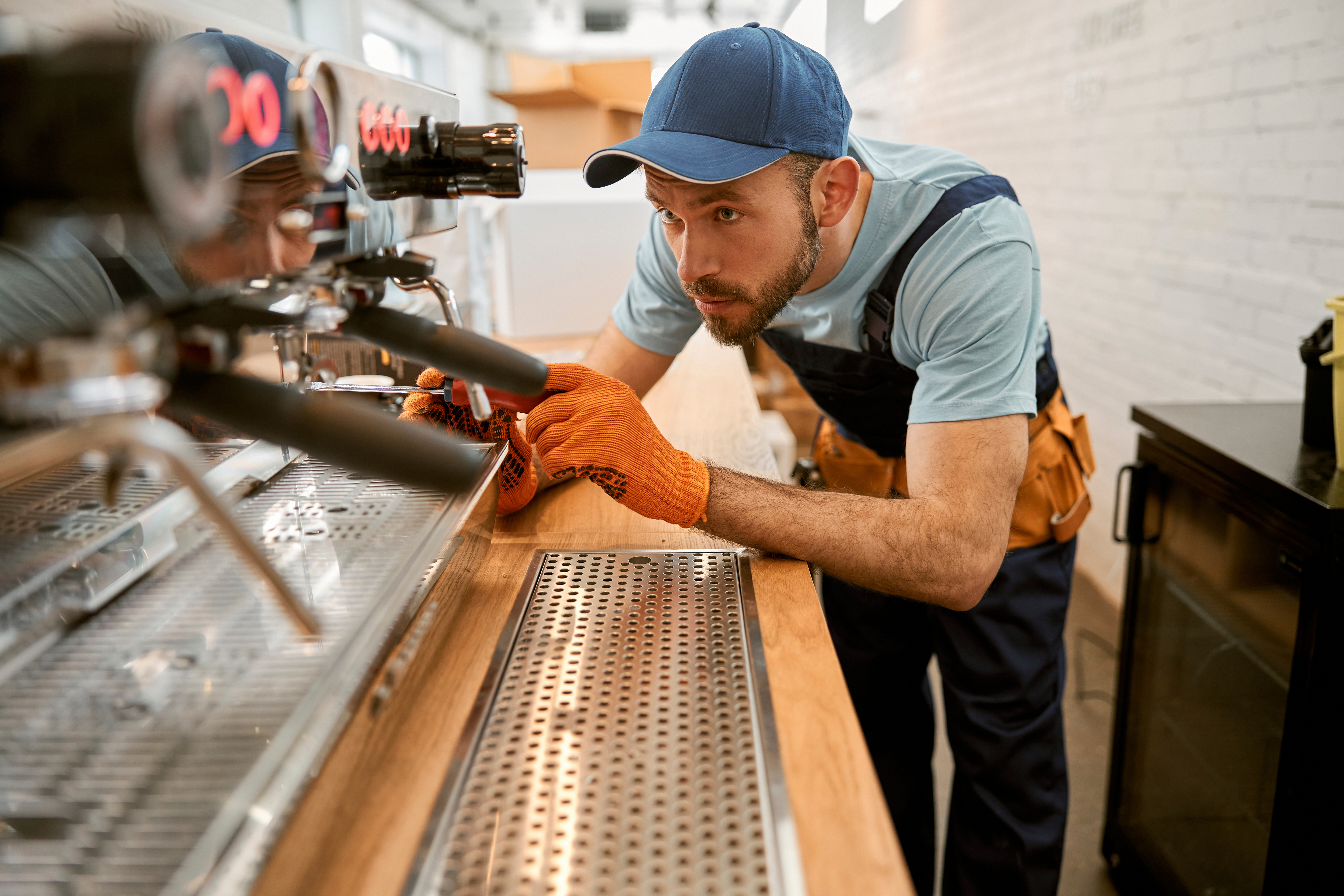 coffee shop with barista using coffee equipment